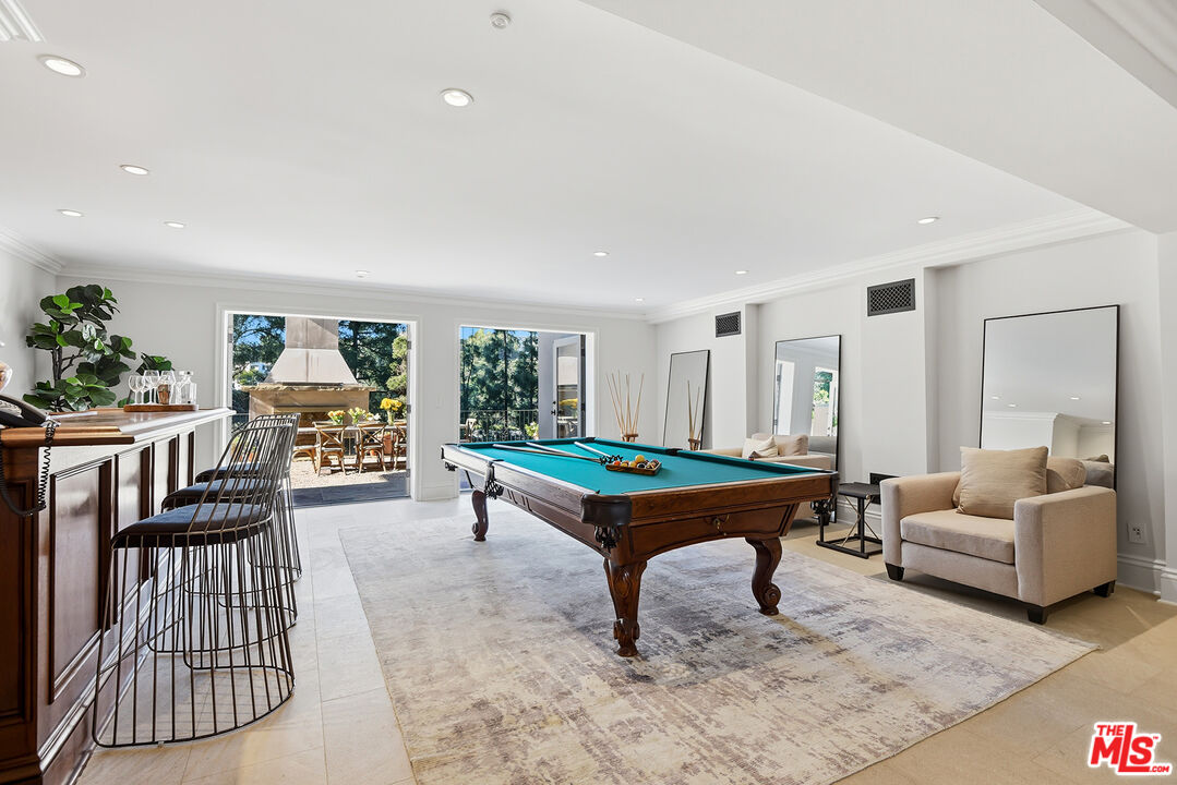 980 Stradella Road Los Angeles, CA 90077 - Photo 19 of 40 a living room with furniture and wooden floor
