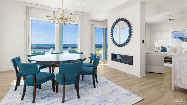 a kitchen with stainless steel appliances granite countertop a refrigerator a stove and a sink