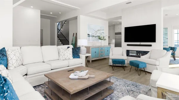 a kitchen with a sink cabinets and wooden floor