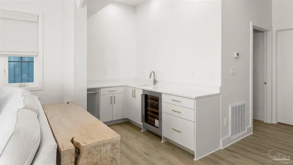 a view of a dining room with furniture wooden floor and a chandelier