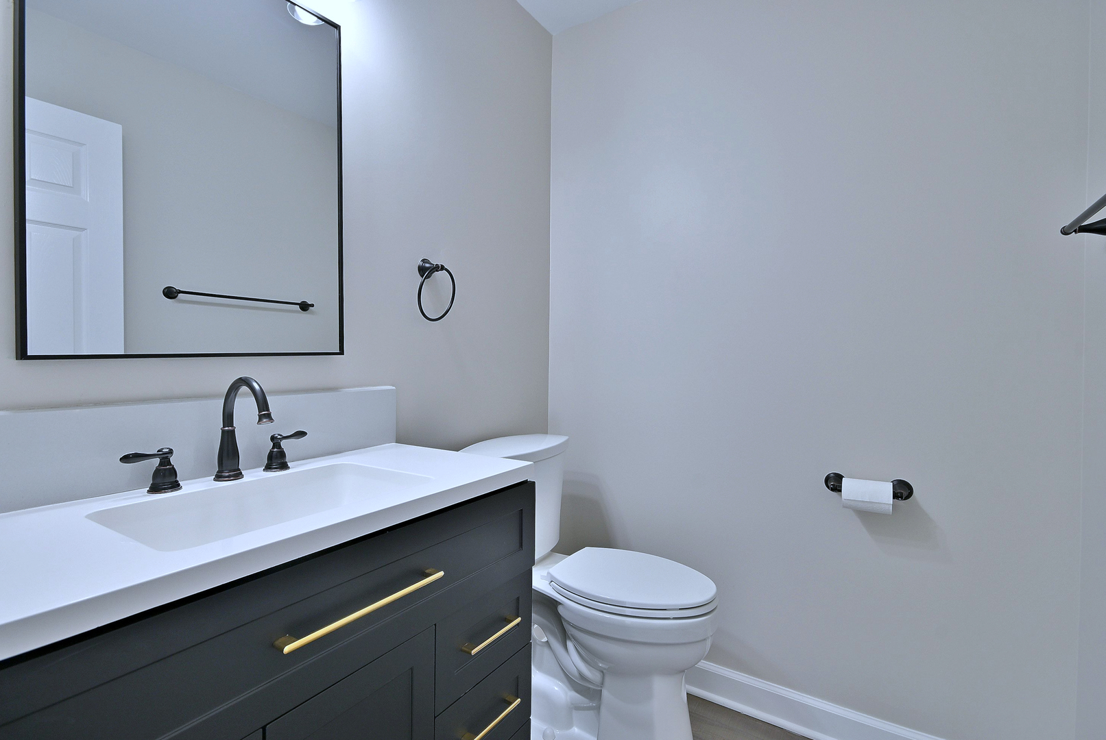 2434 White Barn Road Aurora, IL 60502 - Photo 22 of 45 a bathroom with a sink a toilet and mirror