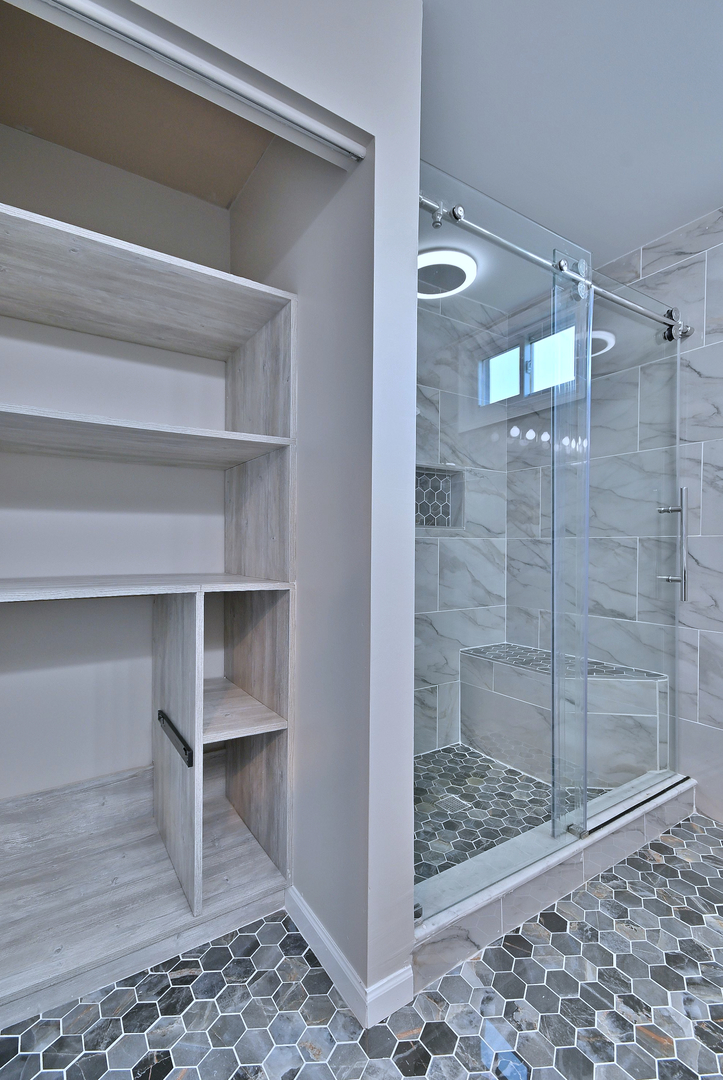 2434 White Barn Road Aurora, IL 60502 - Photo 32 of 45 a bathroom with a glass shower door