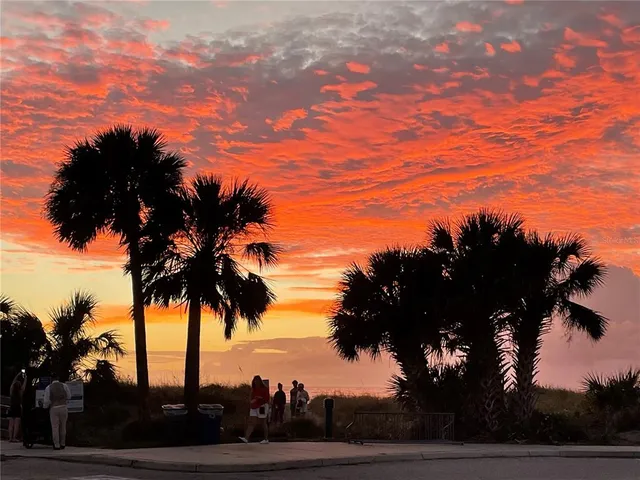 a view of a kitchen with a sink and a wooden floor
