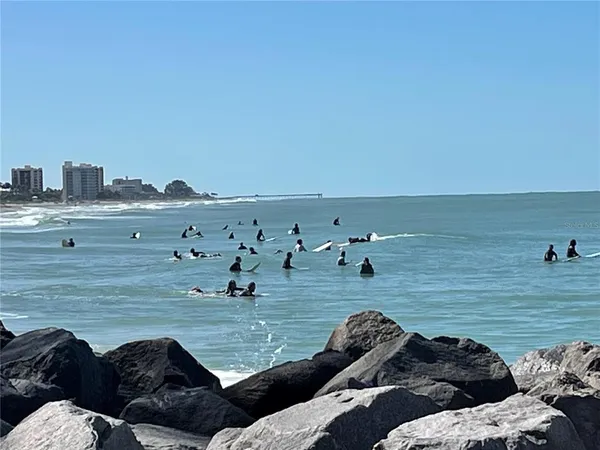 a view of a white house with a yard