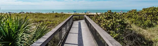 a spacious bedroom with a bed and a large window