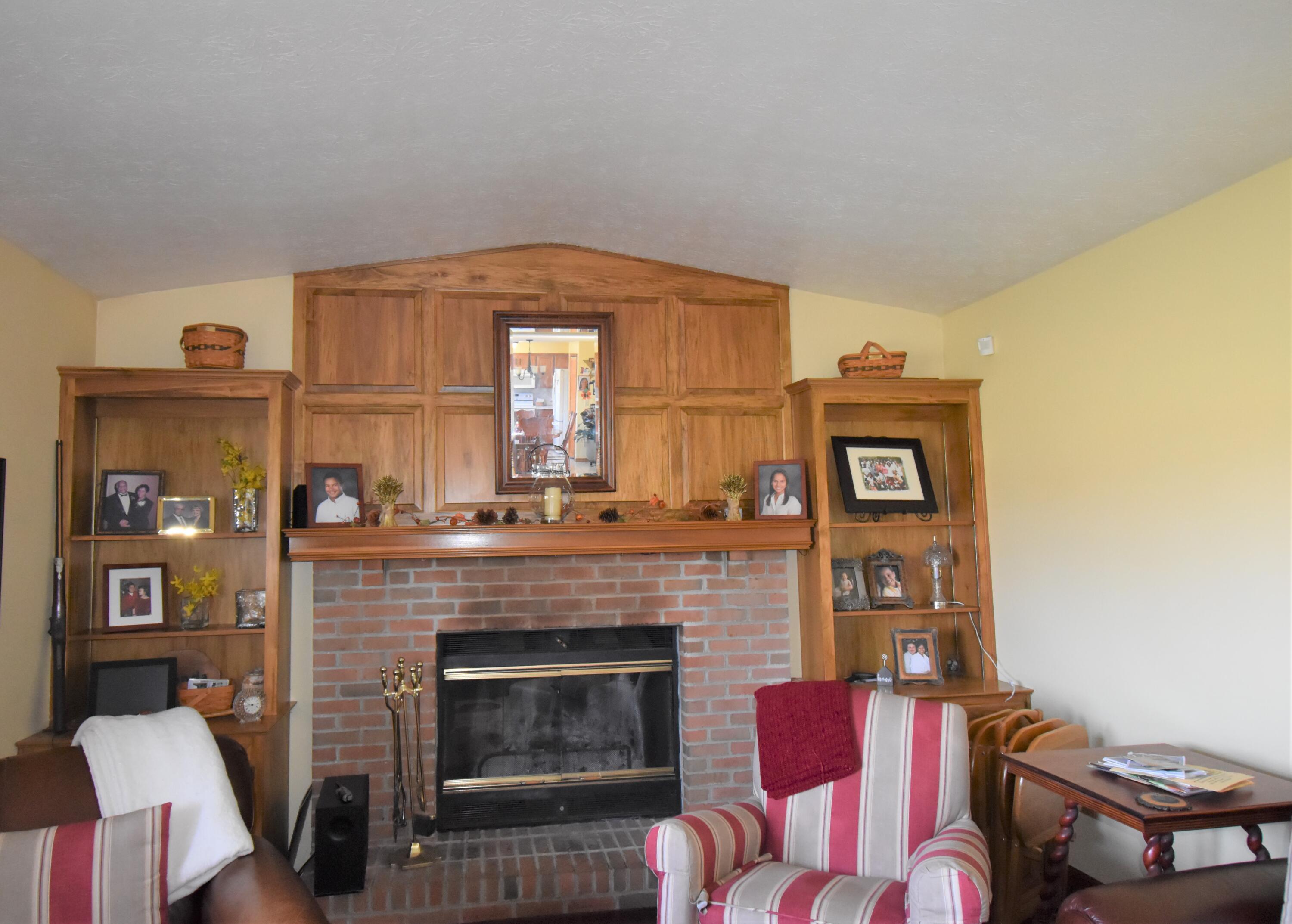 7680 Degood Road Ostrander, OH 43061 - Photo 18 of 42 Beautiful brick fireplace with mantle.