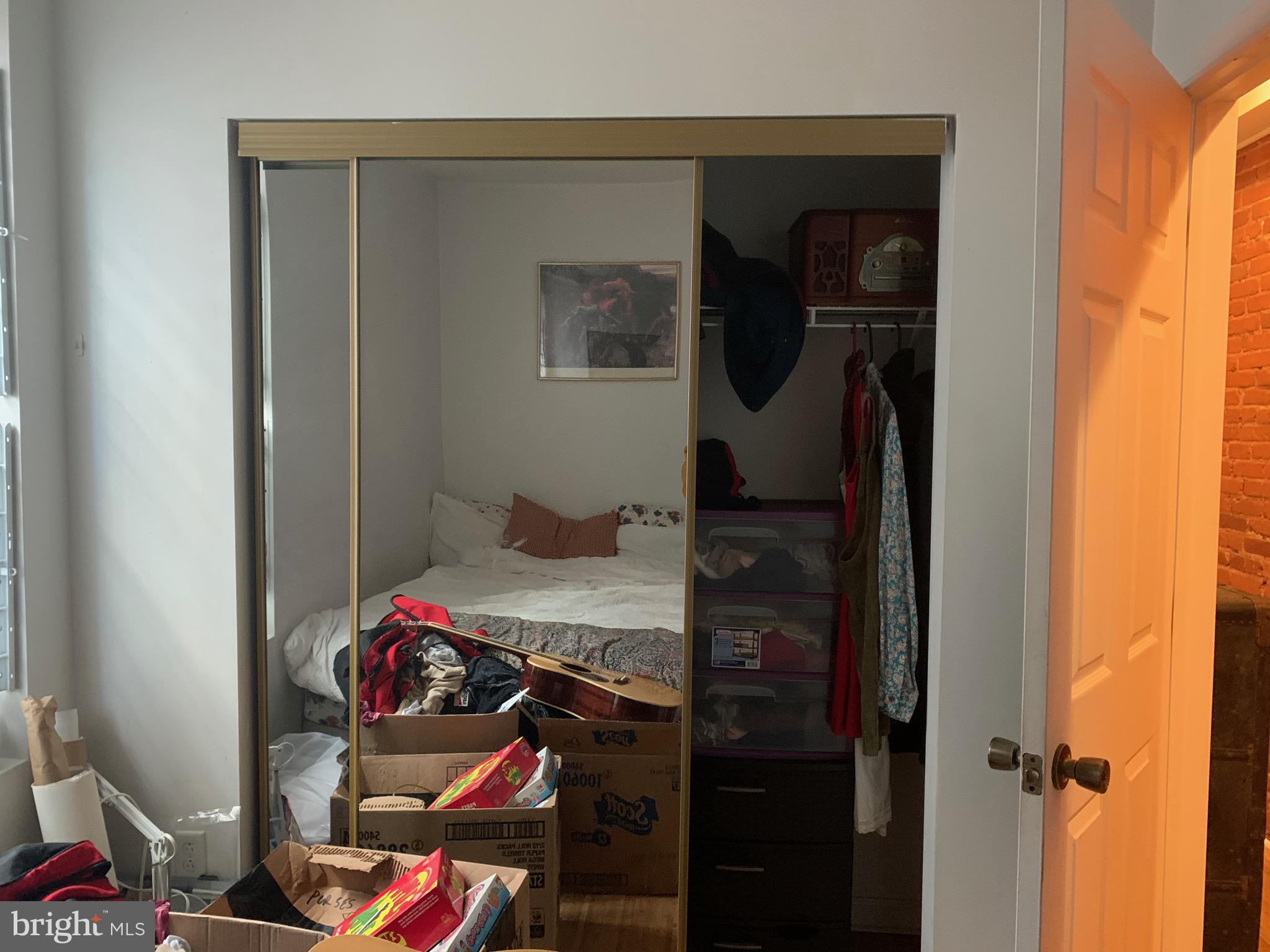 4031 Green Street, Unit A Philadelphia, PA 19104 - Photo 6 of 12 a bedroom with a bed and a mirror