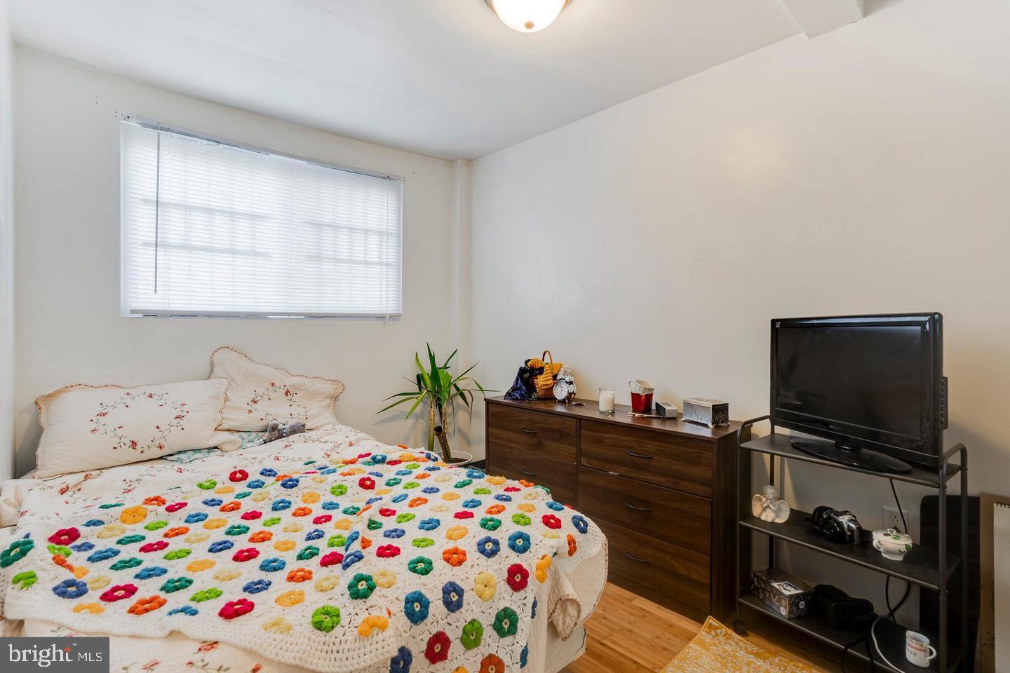 4031 Green Street, Unit A Philadelphia, PA 19104 - Photo 7 of 12 a bedroom with a bed and flat screen tv