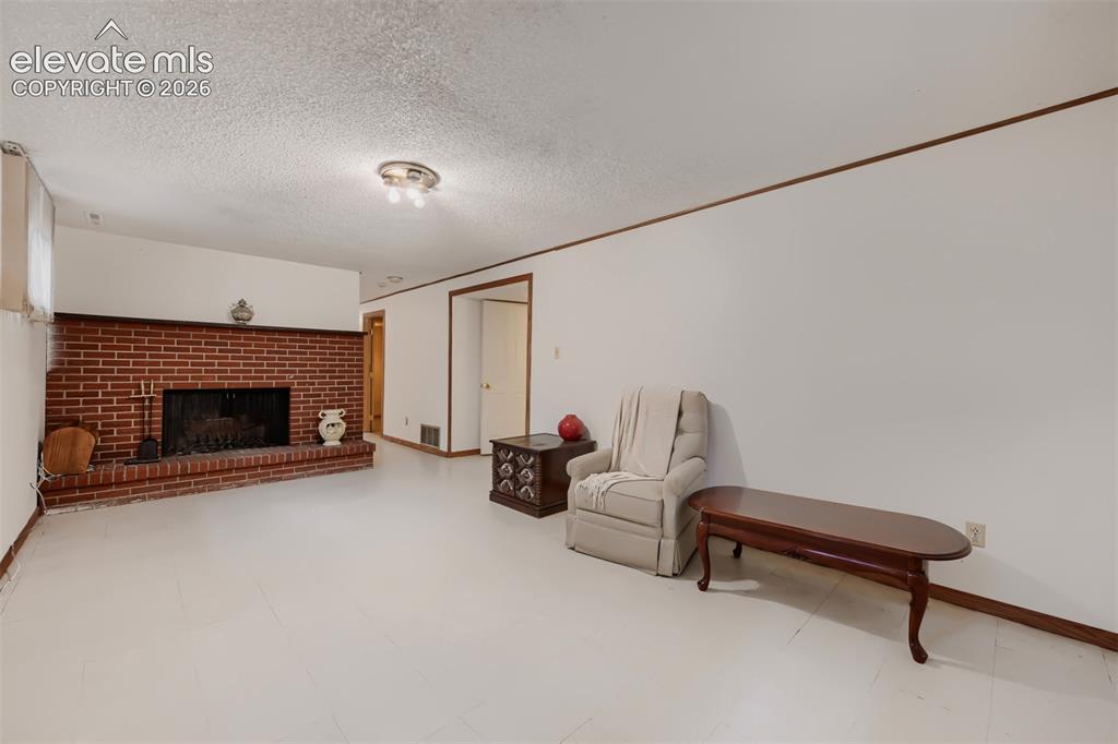 4618 Ridgeglen Road Colorado Springs, CO 80918 - Photo 20 of 27 Family Room with wood burning fireplace