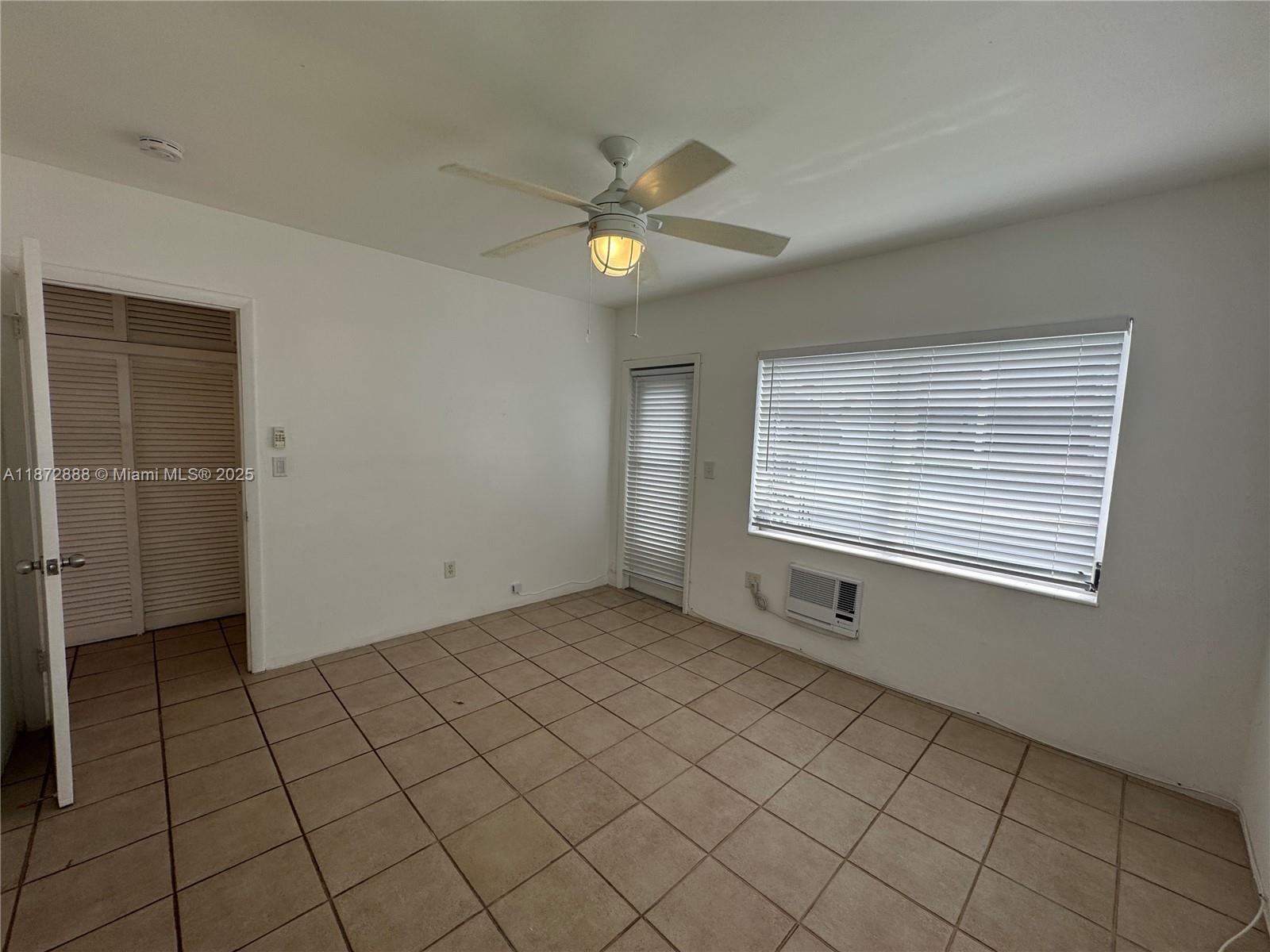 921 Meridian Avenue, Unit 7 Miami Beach, FL 33139 - Photo 11 of 31 a view of an empty room with a window