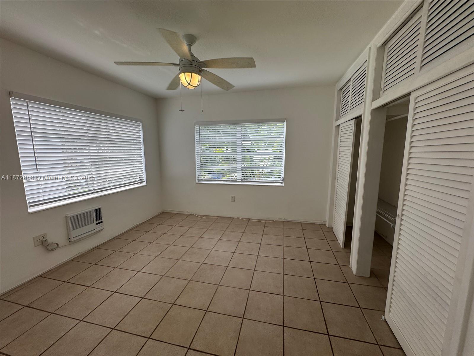 921 Meridian Avenue, Unit 7 Miami Beach, FL 33139 - Photo 13 of 31 a view of an empty room with a window