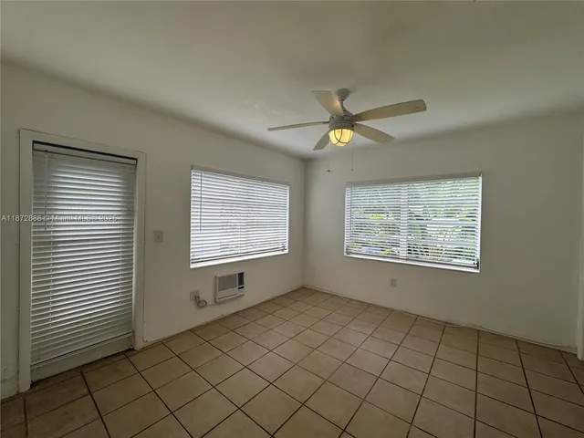 a view of an empty room and window