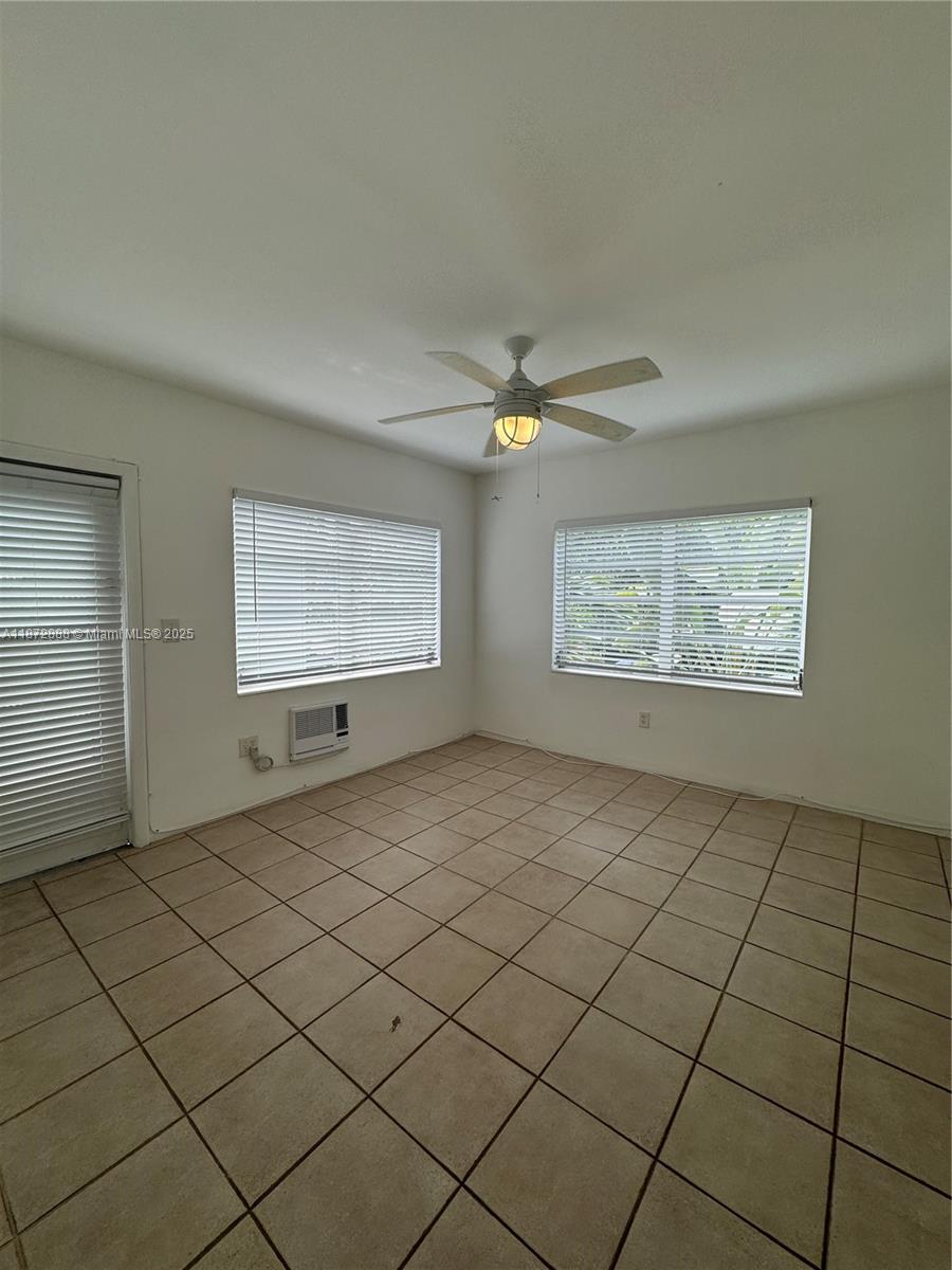 921 Meridian Avenue, Unit 7 Miami Beach, FL 33139 - Photo 16 of 31 a view of an empty room and window
