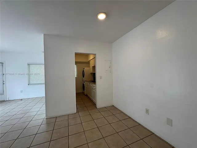 a view of an empty room and fire place