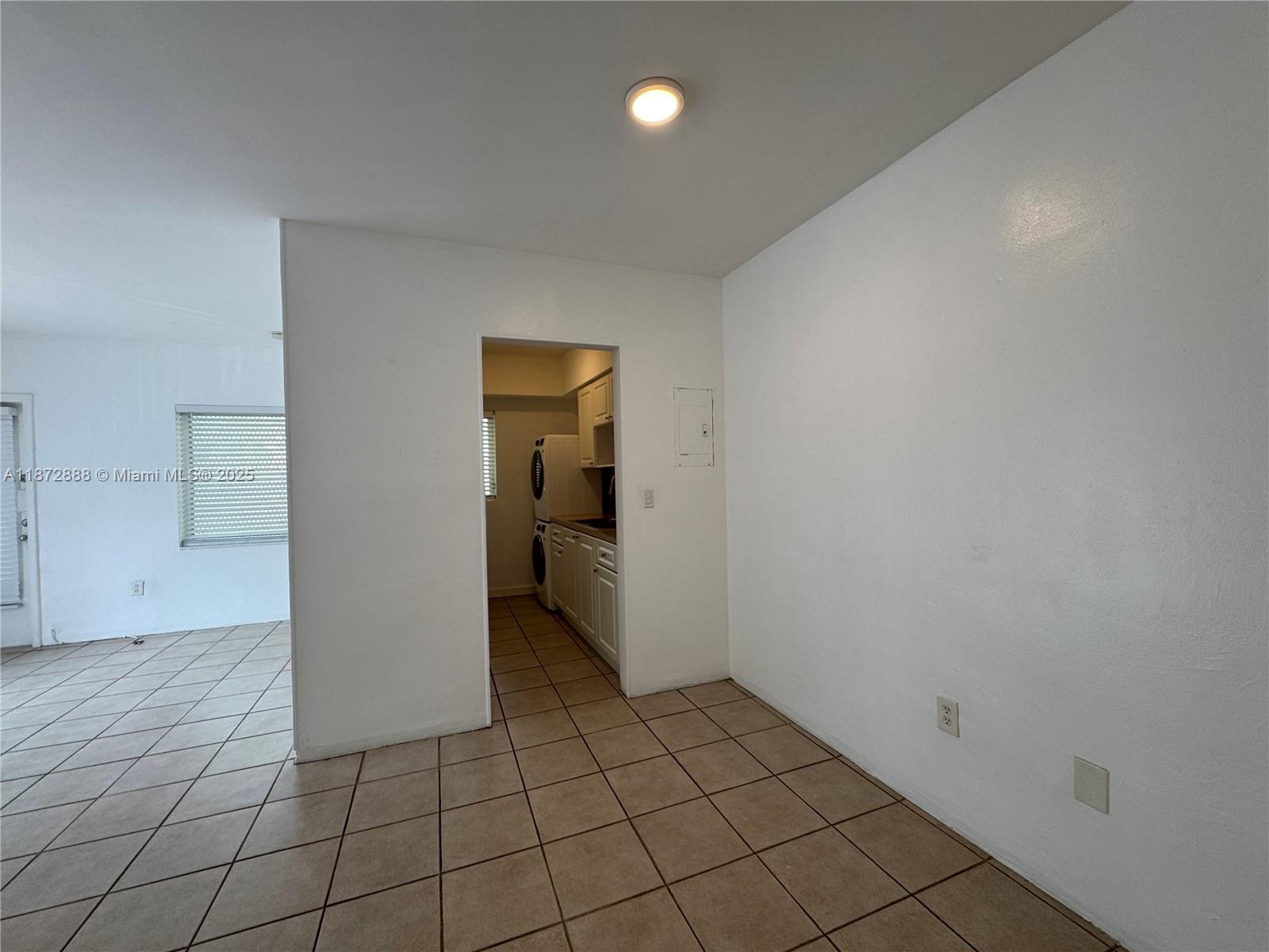 921 Meridian Avenue, Unit 7 Miami Beach, FL 33139 - Photo 9 of 31 a view of an empty room and fire place