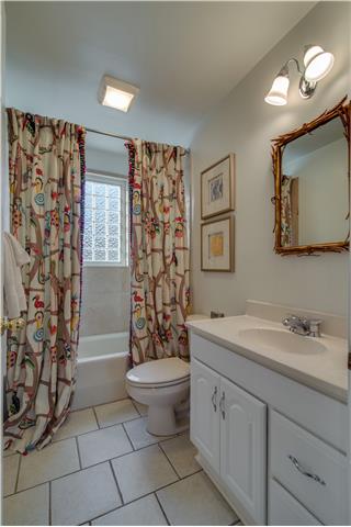 4215 Sneed Road Nashville, TN 37215 - Photo 11 of 20 a spacious bathroom with a toilet sink and mirror