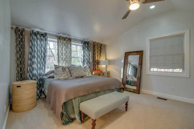 4215 Sneed Road Nashville, TN 37215 - Photo 12 of 20 a bedroom with a bed and a mirror
