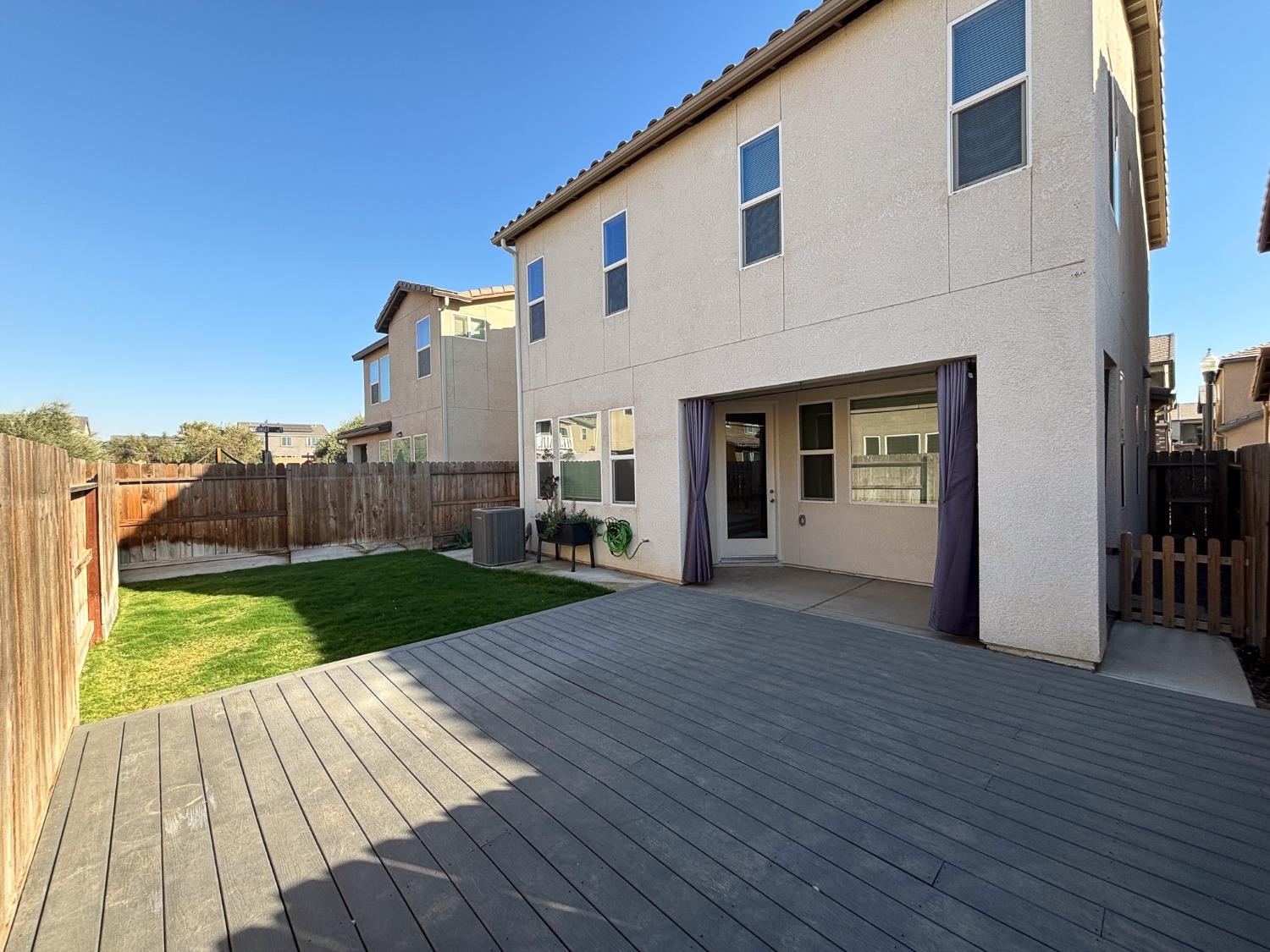 827 Fir Street West Madera, CA 93636 - Photo 16 of 63 a view of a house with a yard
