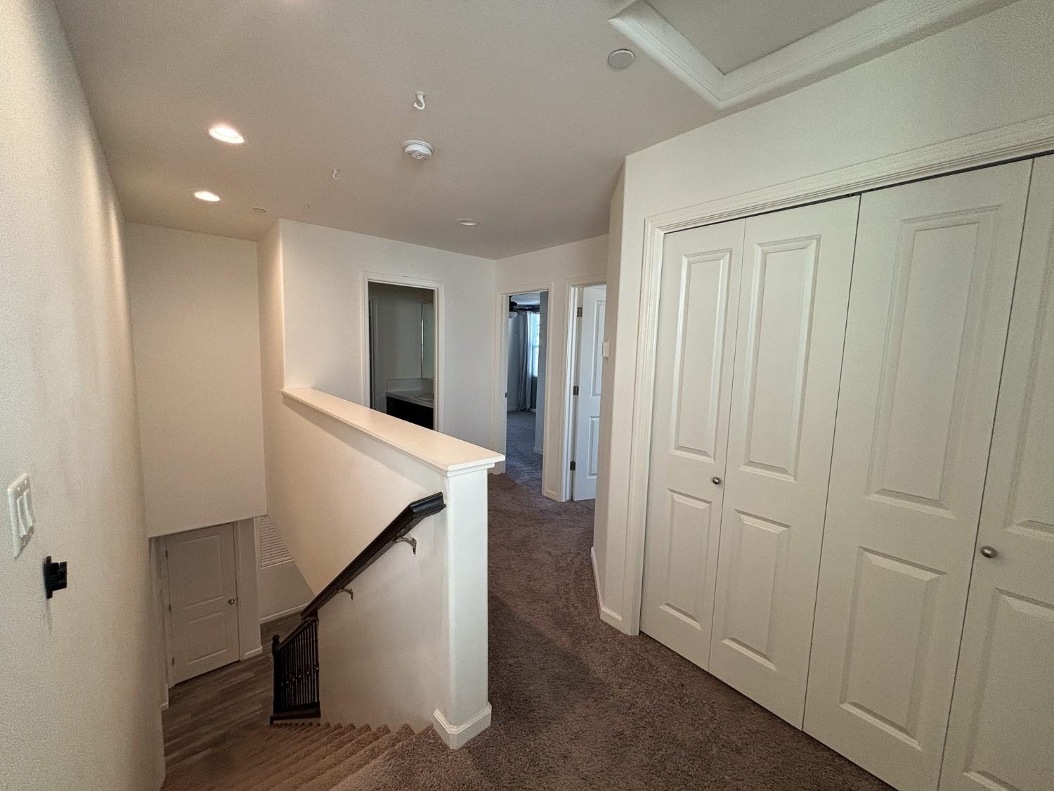827 Fir Street West Madera, CA 93636 - Photo 23 of 63 a view of a hallway with staircase