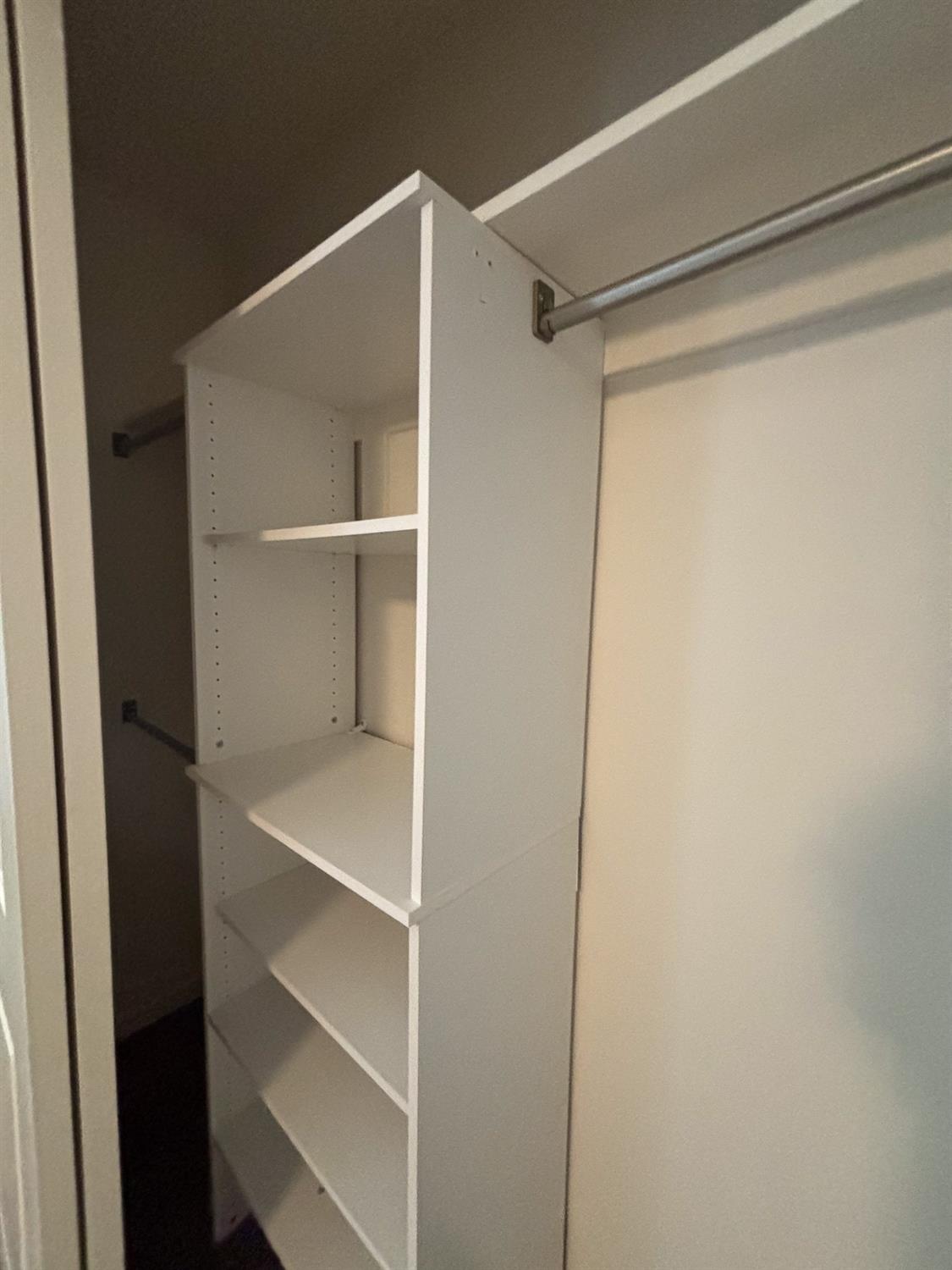 827 Fir Street West Madera, CA 93636 - Photo 29 of 63 a view of an empty walk in closet