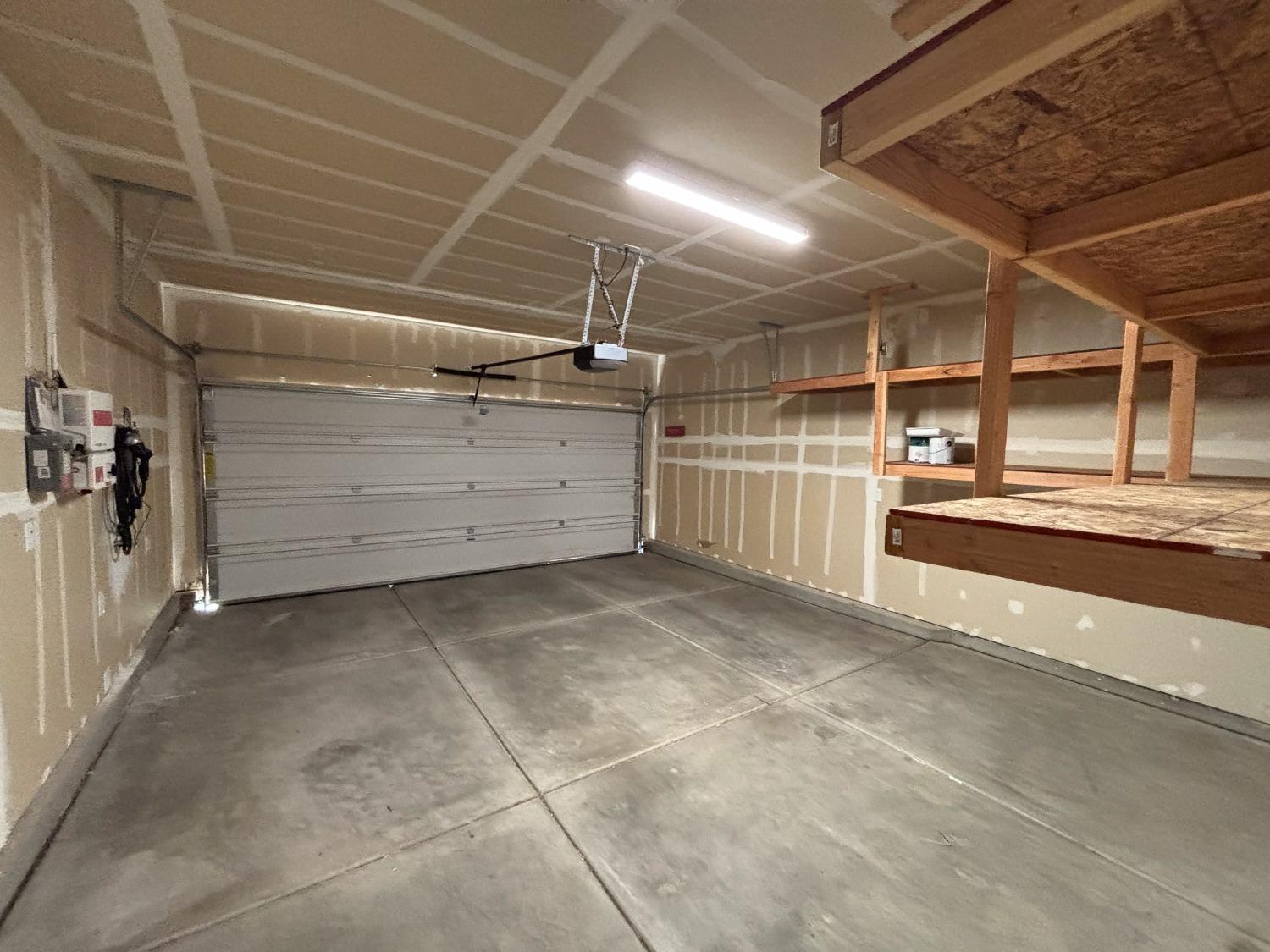 827 Fir Street West Madera, CA 93636 - Photo 49 of 63 a view of a garage with wooden walls
