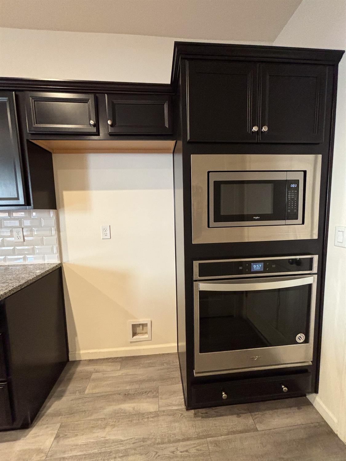 827 Fir Street West Madera, CA 93636 - Photo 8 of 63 a stove top oven sitting inside of a kitchen