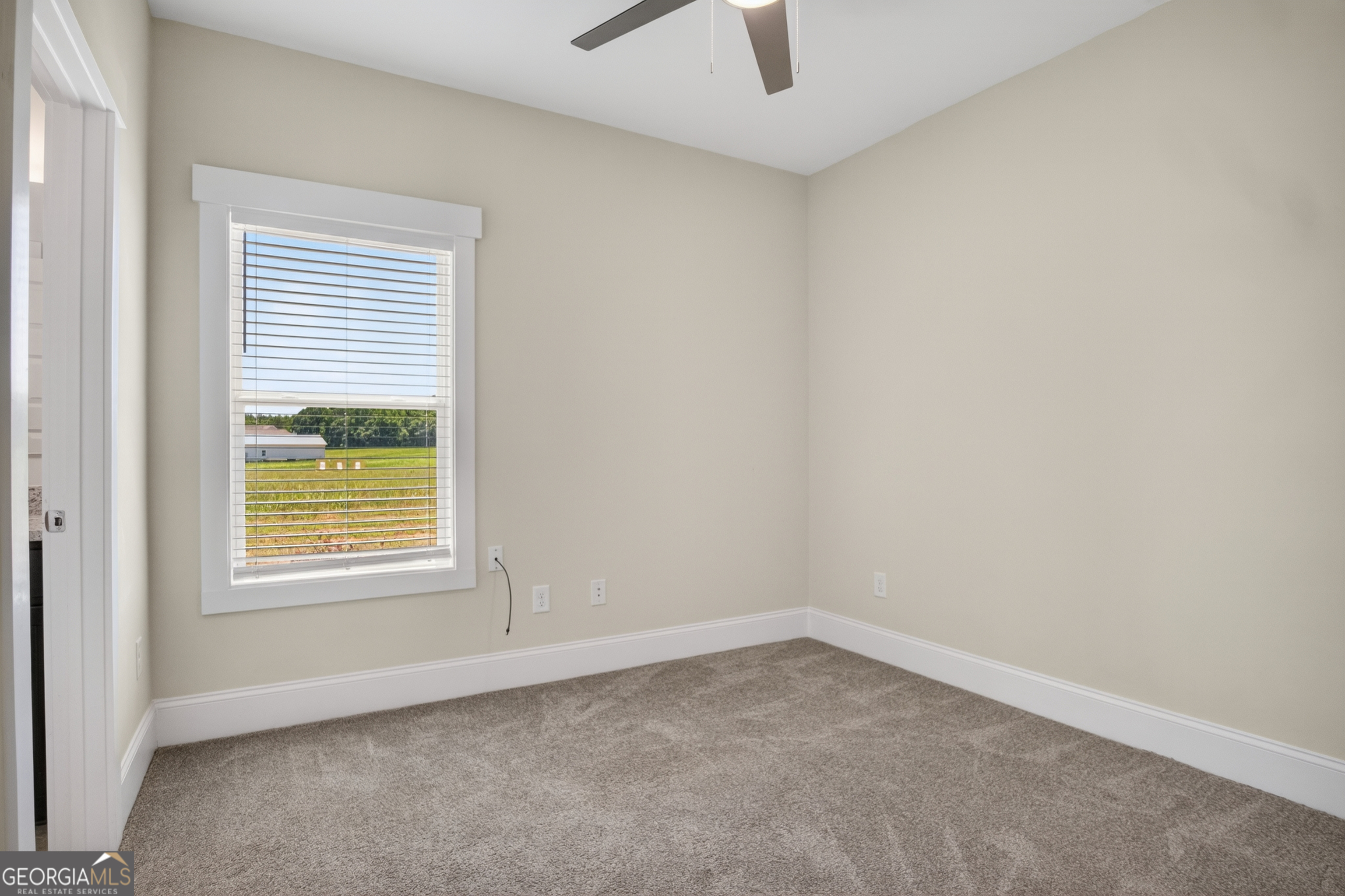1350-c O Draper Road Comer, GA 30629 - Photo 20 of 47 an empty room with a window and a fan