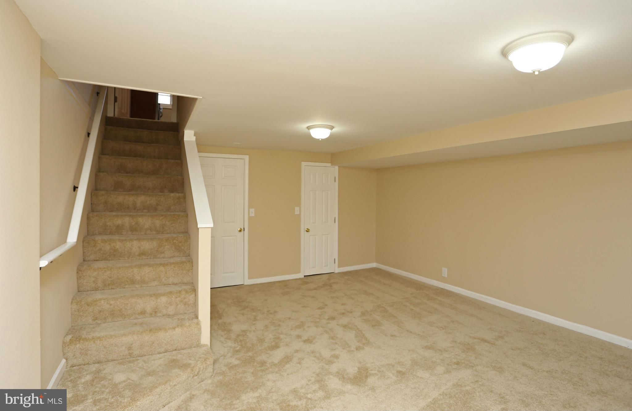 4440 Fenor Road Baltimore, MD 21227 - Photo 22 of 30 a view of an empty room with stairs