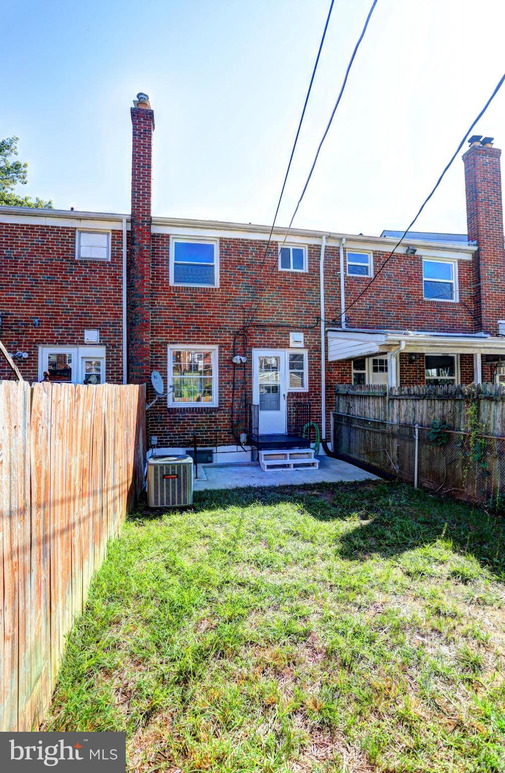 4440 Fenor Road Baltimore, MD 21227 - Photo 29 of 30 a view of house with a yard and patio
