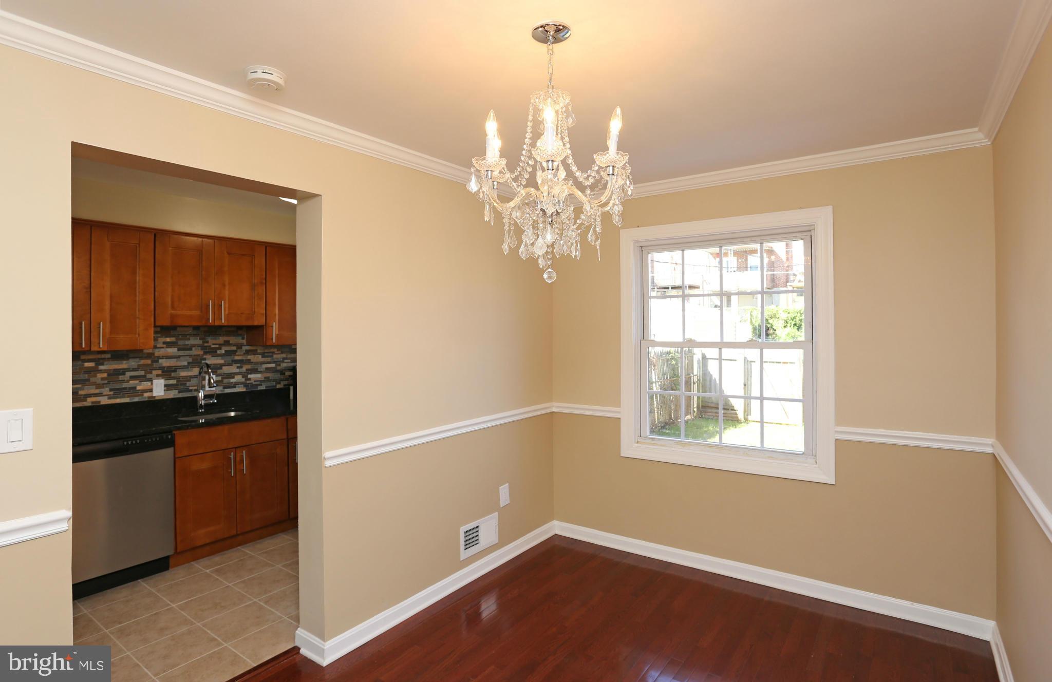 4440 Fenor Road Baltimore, MD 21227 - Photo 6 of 30 a room with chandelier and window