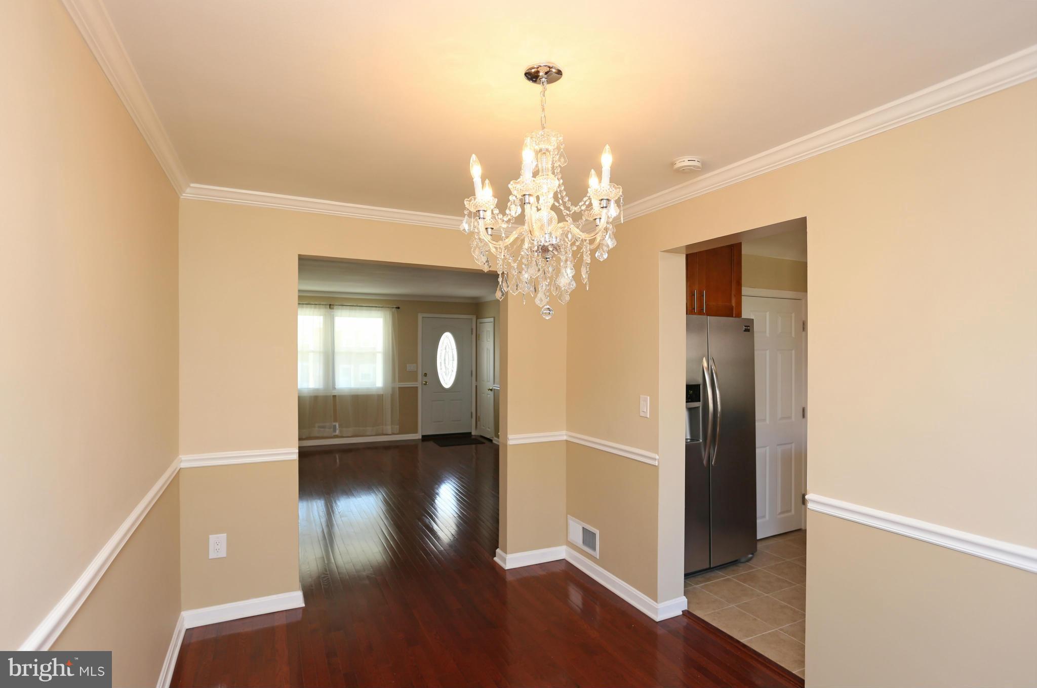 4440 Fenor Road Baltimore, MD 21227 - Photo 7 of 30 a view of a livingroom with a chandelier