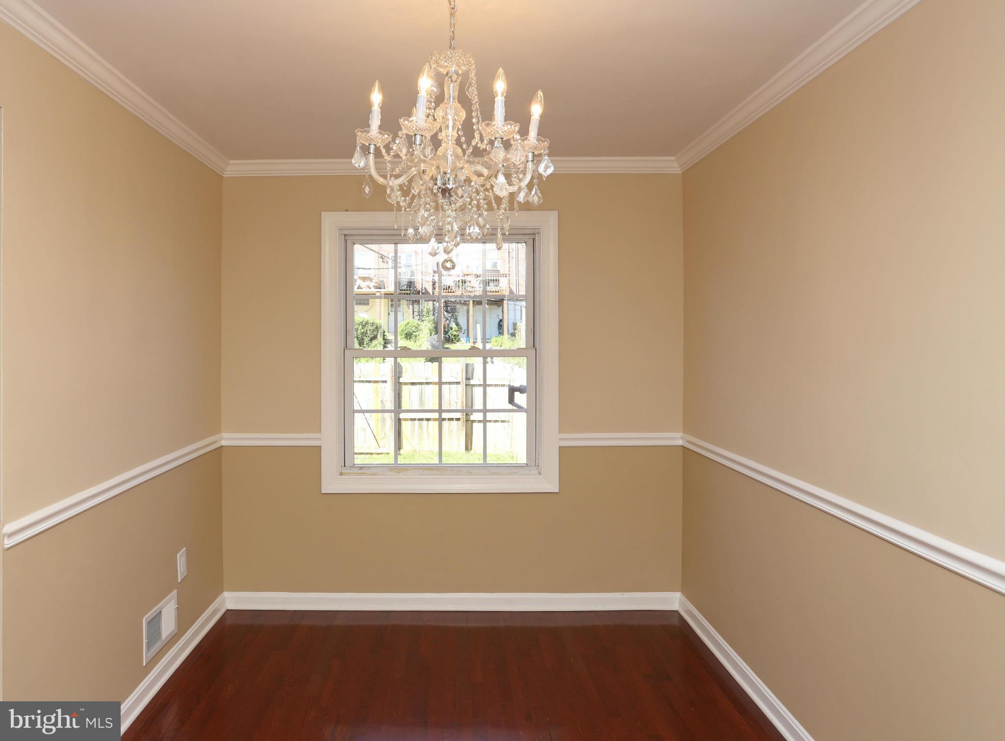 4440 Fenor Road Baltimore, MD 21227 - Photo 8 of 30 a view of room with window and chandelier