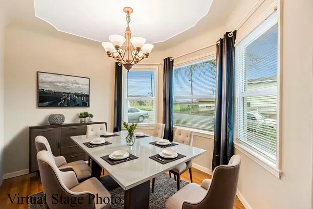 a view of a dining room with furniture window and outside view