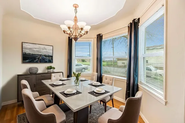 a view of a dining room with furniture window and outside view