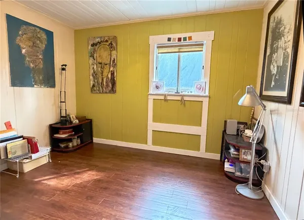 a room with furniture and wooden floor