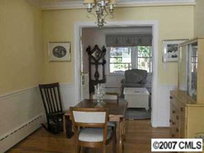 440 Westbury Road Charlotte, NC 28211 - Photo 3 of 8 a living room with furniture and a chandelier