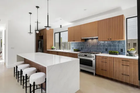 a kitchen with furniture and a stove