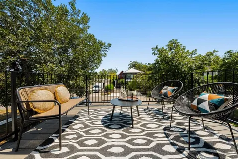 a view of a chairs and tables in the patio