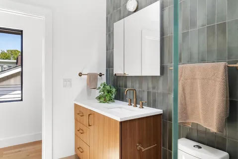 a bathroom with a sink and mirror