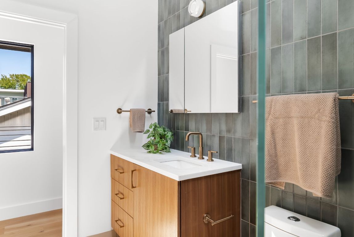 5212 Evans Avenue Austin, TX 78751 - Photo 21 of 34 a bathroom with a sink and mirror