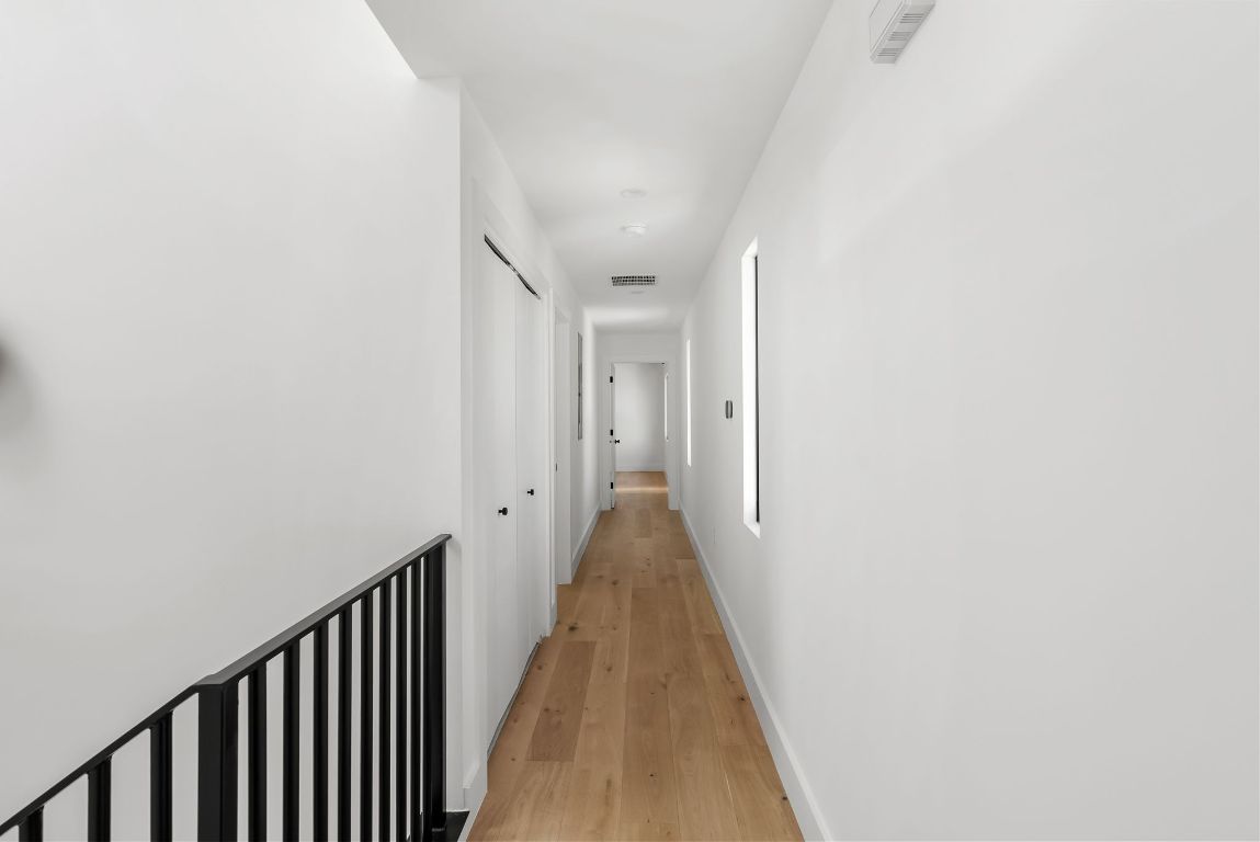 5212 Evans Avenue Austin, TX 78751 - Photo 23 of 34 a view of a hallway with wooden floor