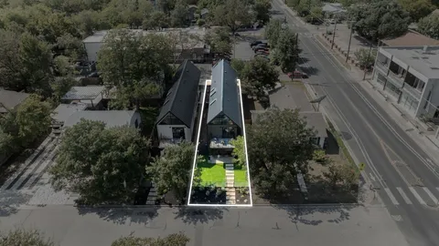 an aerial view of house with yard swimming pool and outdoor seating