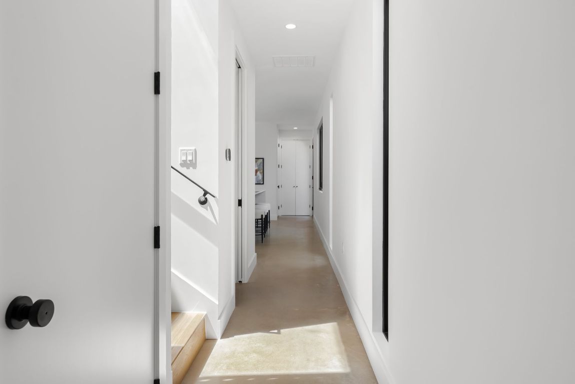 5212 Evans Avenue Austin, TX 78751 - Photo 8 of 34 a view of a hallway with a white walls