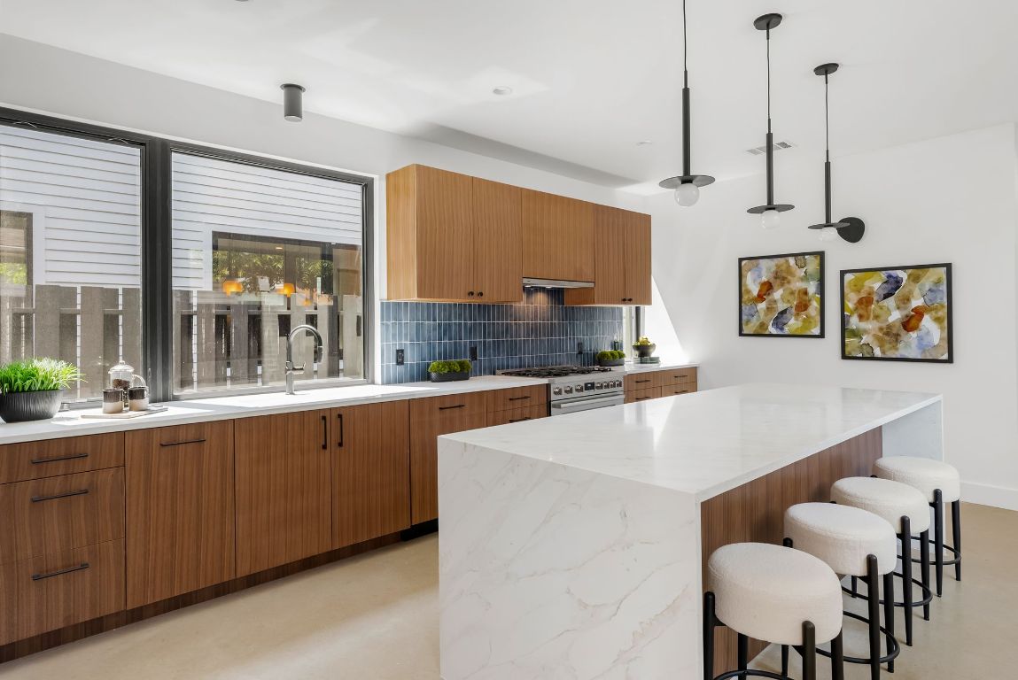 5212 Evans Avenue Austin, TX 78751 - Photo 9 of 34 a large kitchen with lots of counter space and windows
