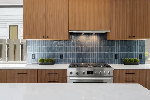 a kitchen with a stove and cabinets