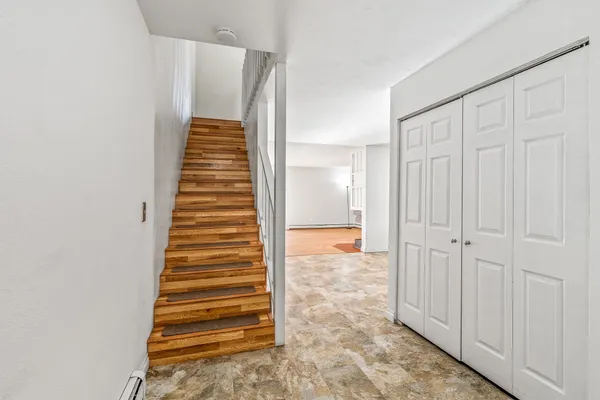 an empty room and chandelier fan