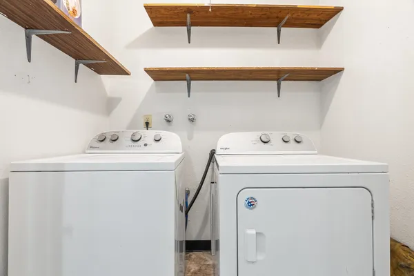 a view of a patio with a table and chairs and wooden floor
