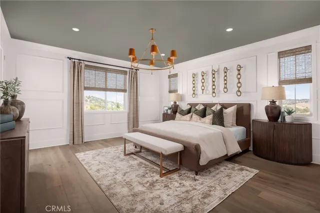 a spacious bedroom with a bed a couch and a window