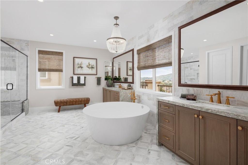22085 Manarola Way Walnut, CA 91789 - Photo 15 of 20 a large spacious bathroom with a double vanity sink a mirror and a bathtub