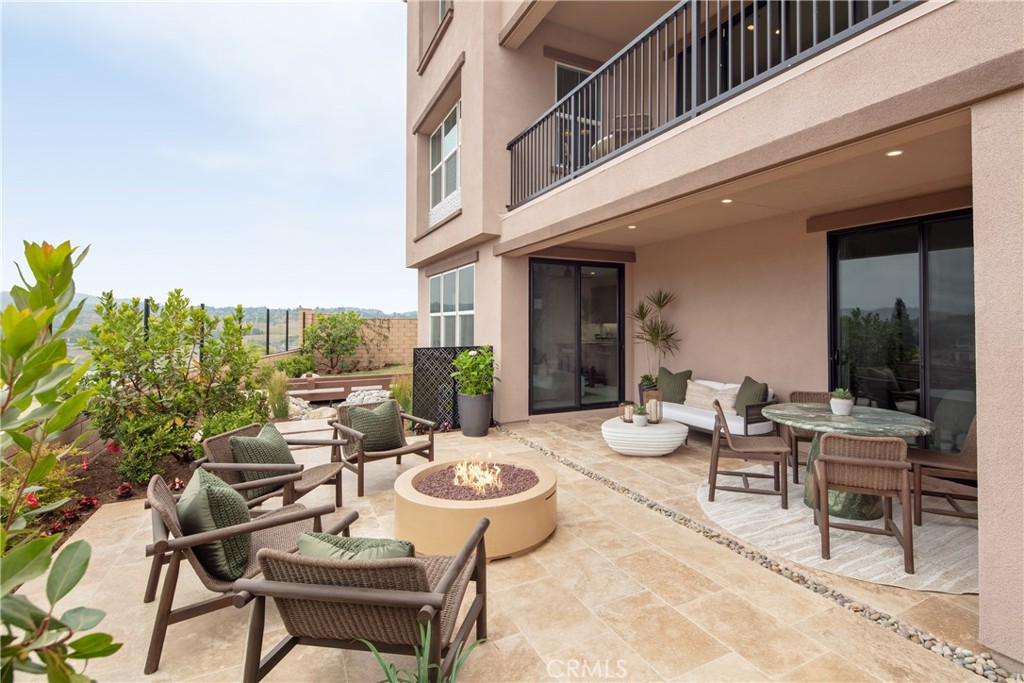 22085 Manarola Way Walnut, CA 91789 - Photo 19 of 20 a view of a patio with couches table and chairs and potted plants